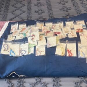 34 baby bracelets with matching pierced earrings (goldtone). New!